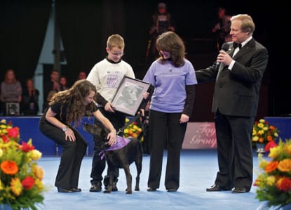 A family of winners bringing their dog on-stage